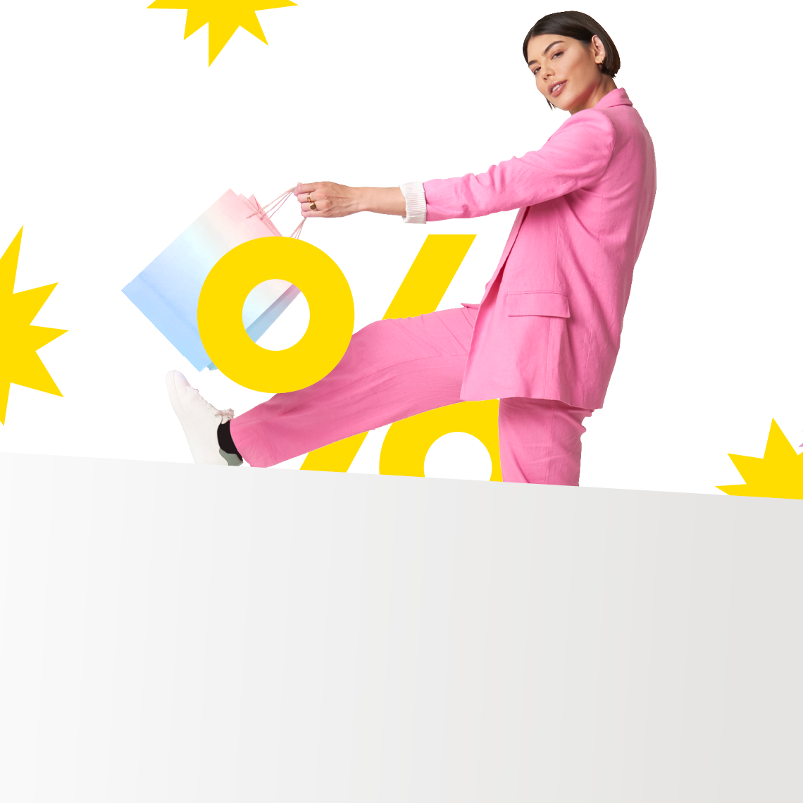 woman in pink with shopping bag