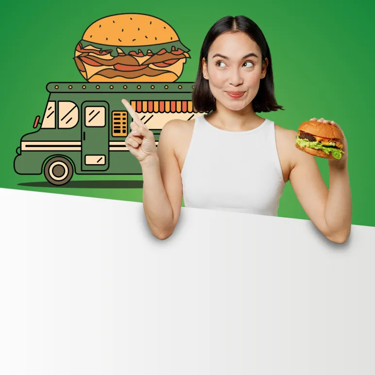 uśmiechnięta dziewczyna z burgerem wskazuje na foodtrucka